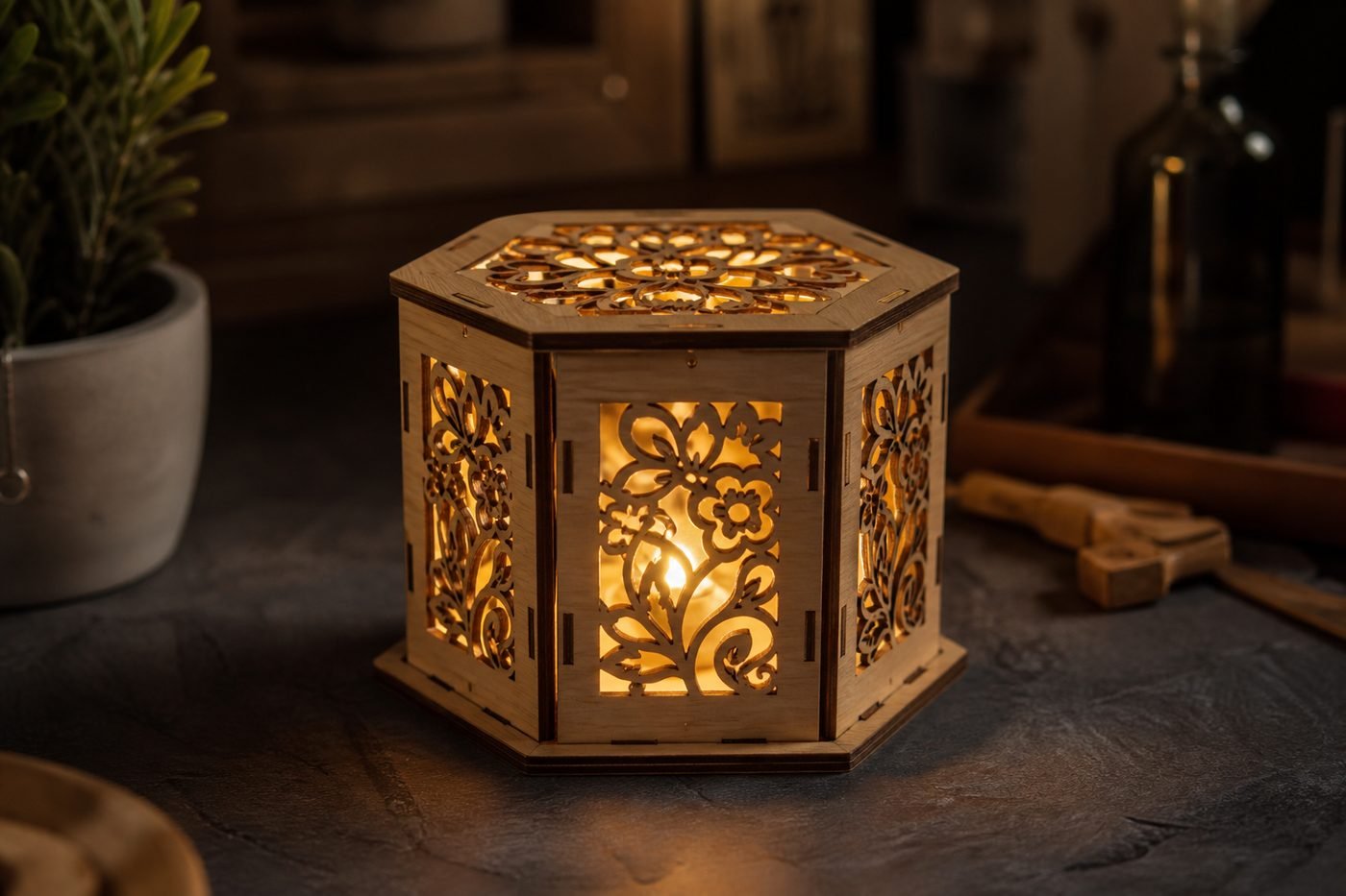 Assembled laser-cut wooden lantern glowing from within